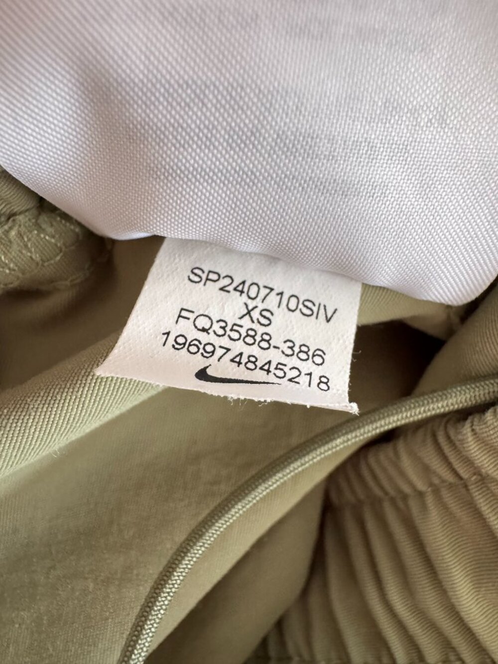 Nike Everythings Woven Mid Rise Open Hem Pant in Olive - Picture 10 of 14